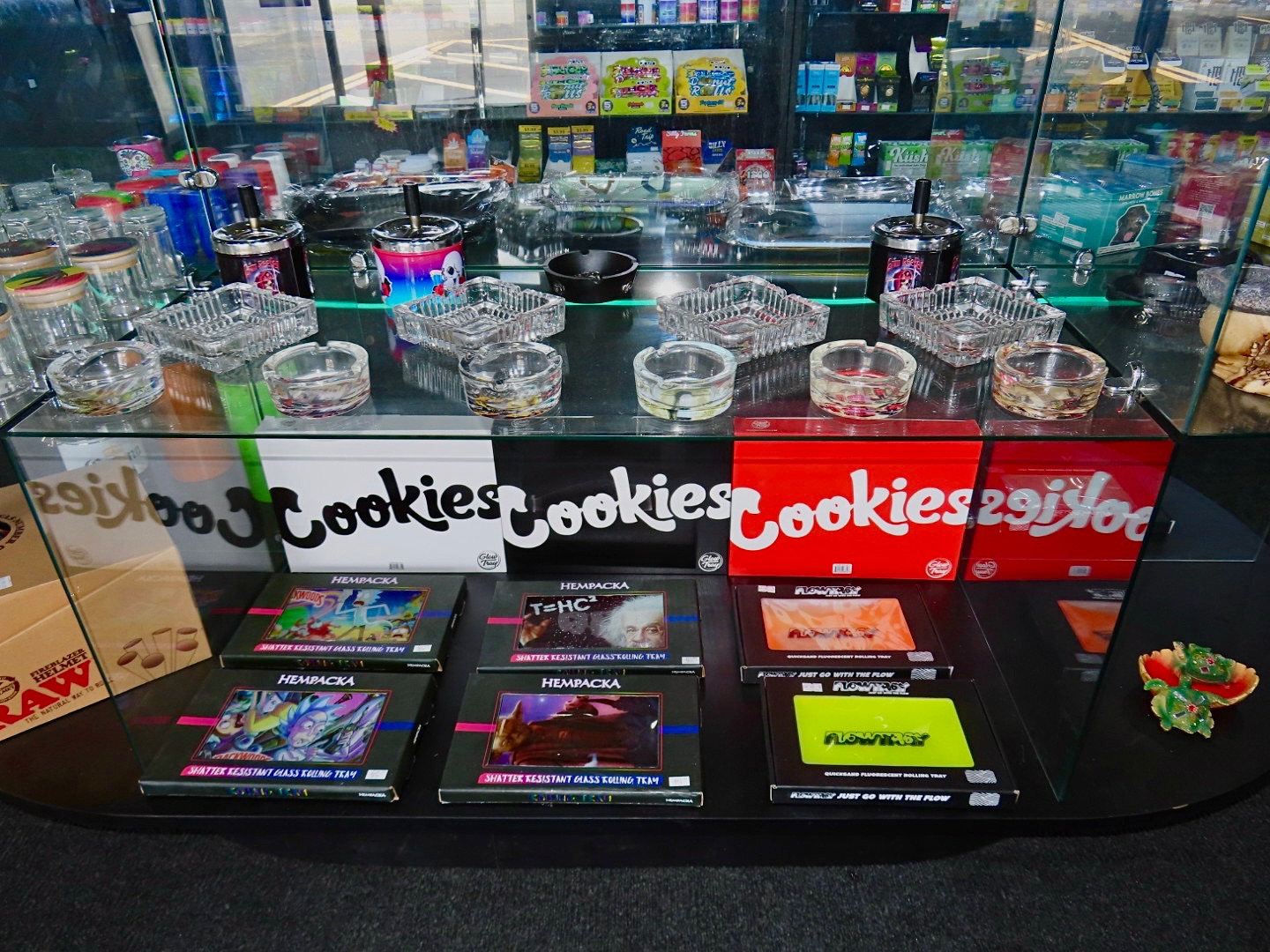 Cookies rolling trays, ashtrays and RAW papers glass display