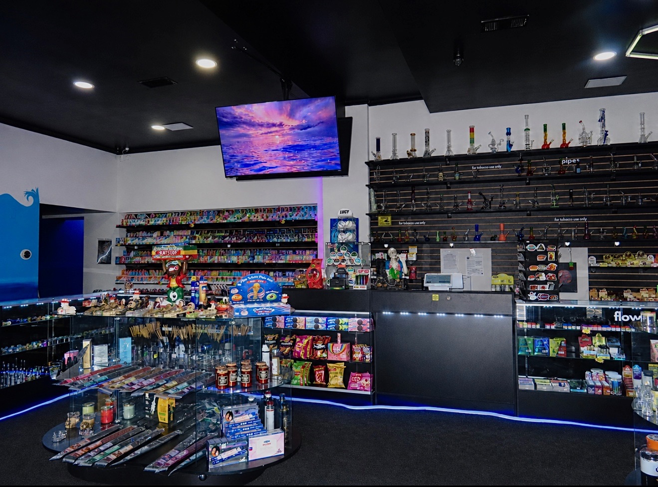 Front counter and glass cases at Pirates Bay Smoke Shop