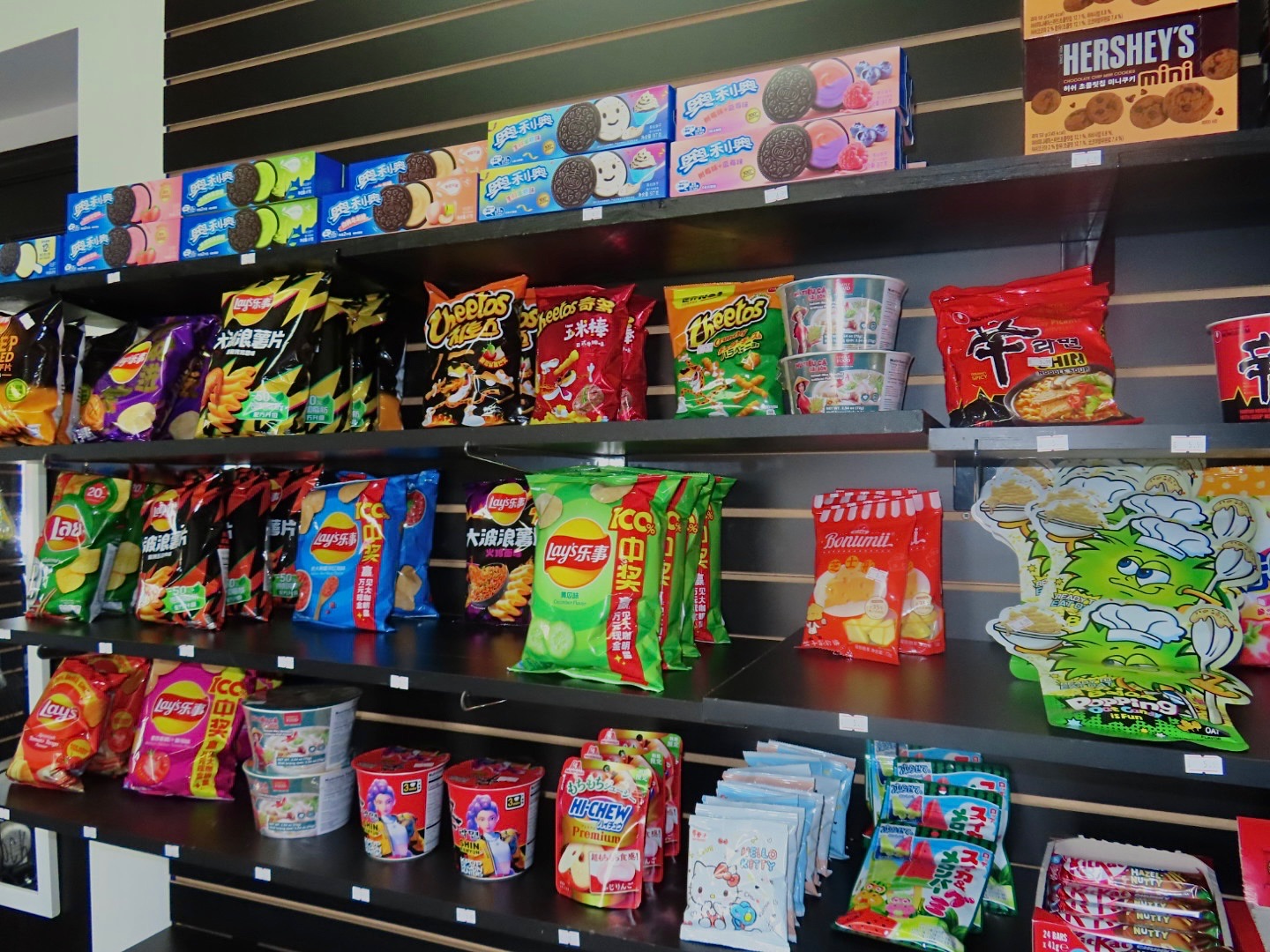 Asian and Korean exotic snacks — imported Oreos, Cheetos, Lay's, Hi-Chew, Hershey's Korean minis