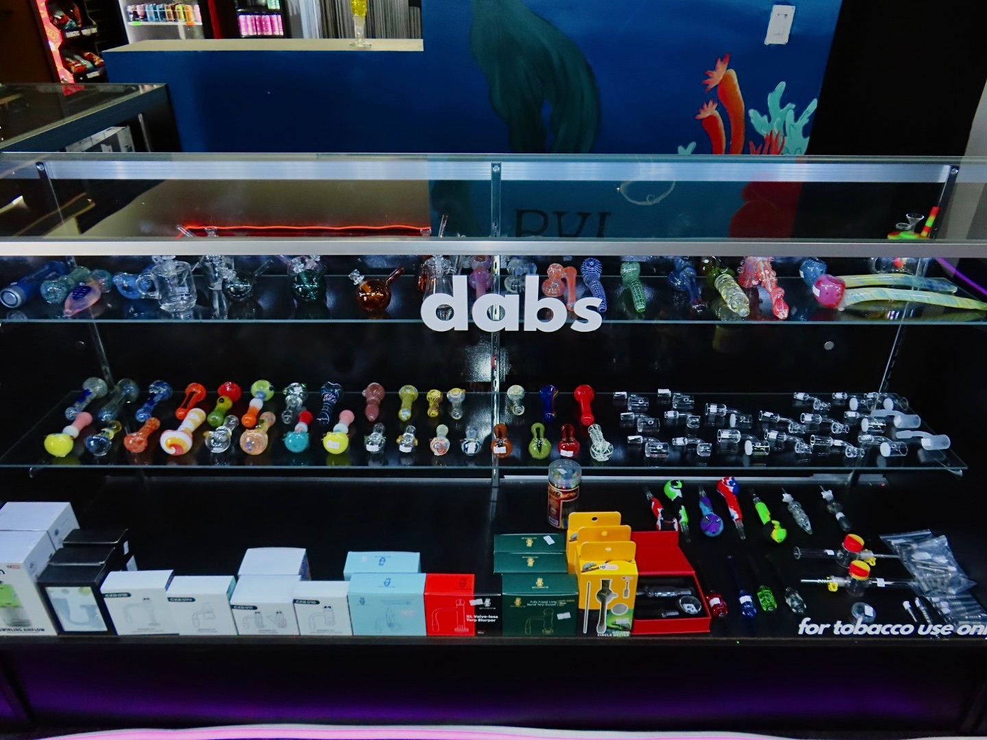Glass pipe and dab rig display — hand pipes, bangers, nectar collectors